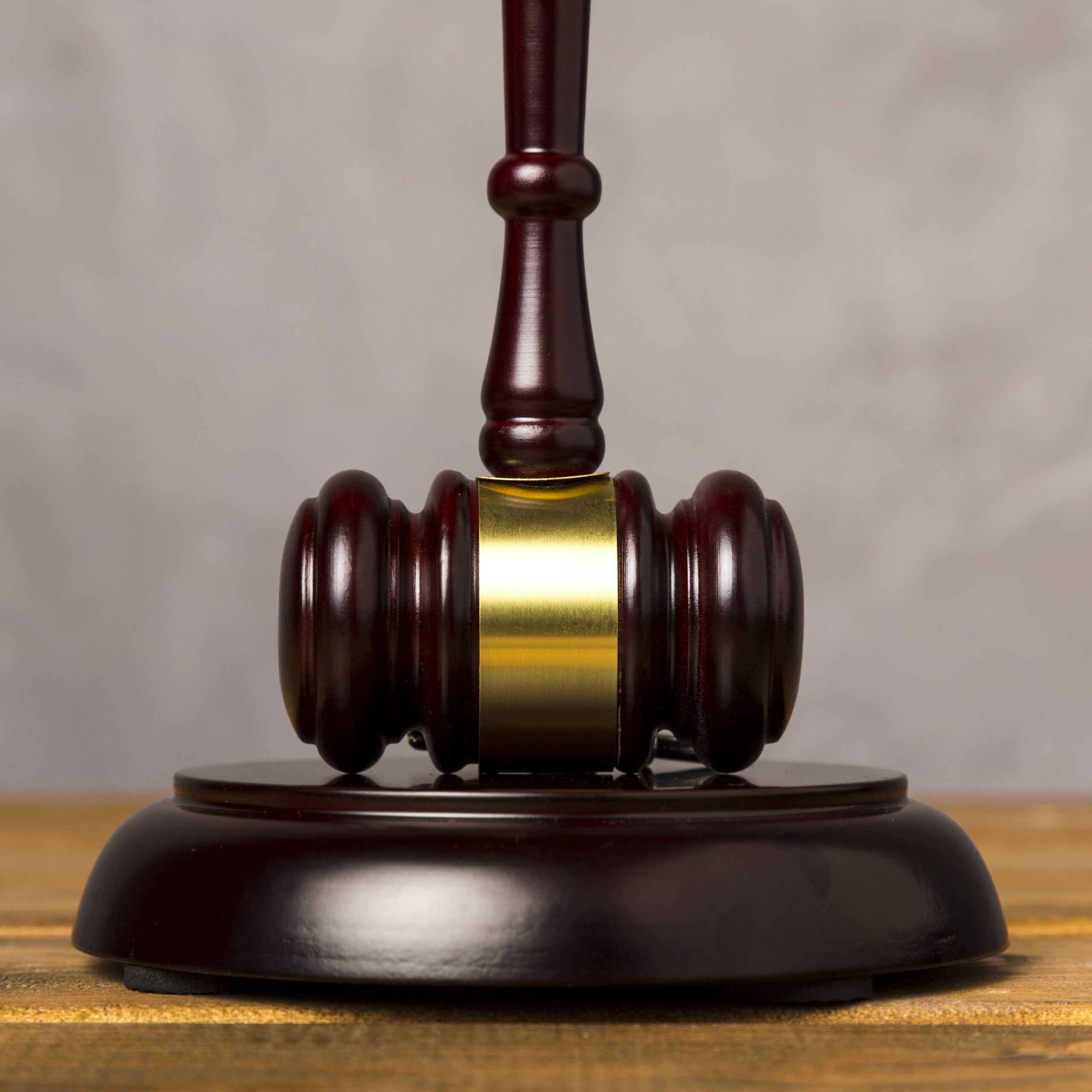 close-up-judge-gavel-with-its-striking-block-min